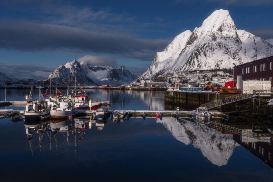 Nestled in the stunning Lofoten Islands of Norway, Reine is a picturesque fishing village known for its dramatic snow-covered peaks, crystal-clear fjords, and colorful waterfront cabins. This serene Arctic destination offers breathtaking reflections, peaceful harbor views, and a perfect blend of natural beauty and traditional coastal life.